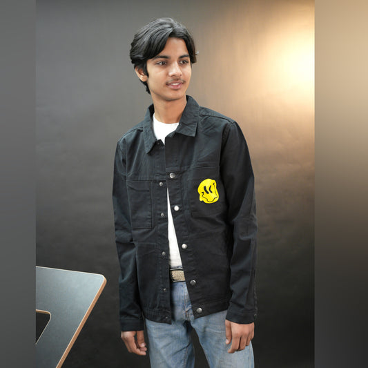 Men’s green and black denim jacket with bold ‘Stay Blessed’ graphic on the back, button-down front, adjustable cuffs, and side pockets