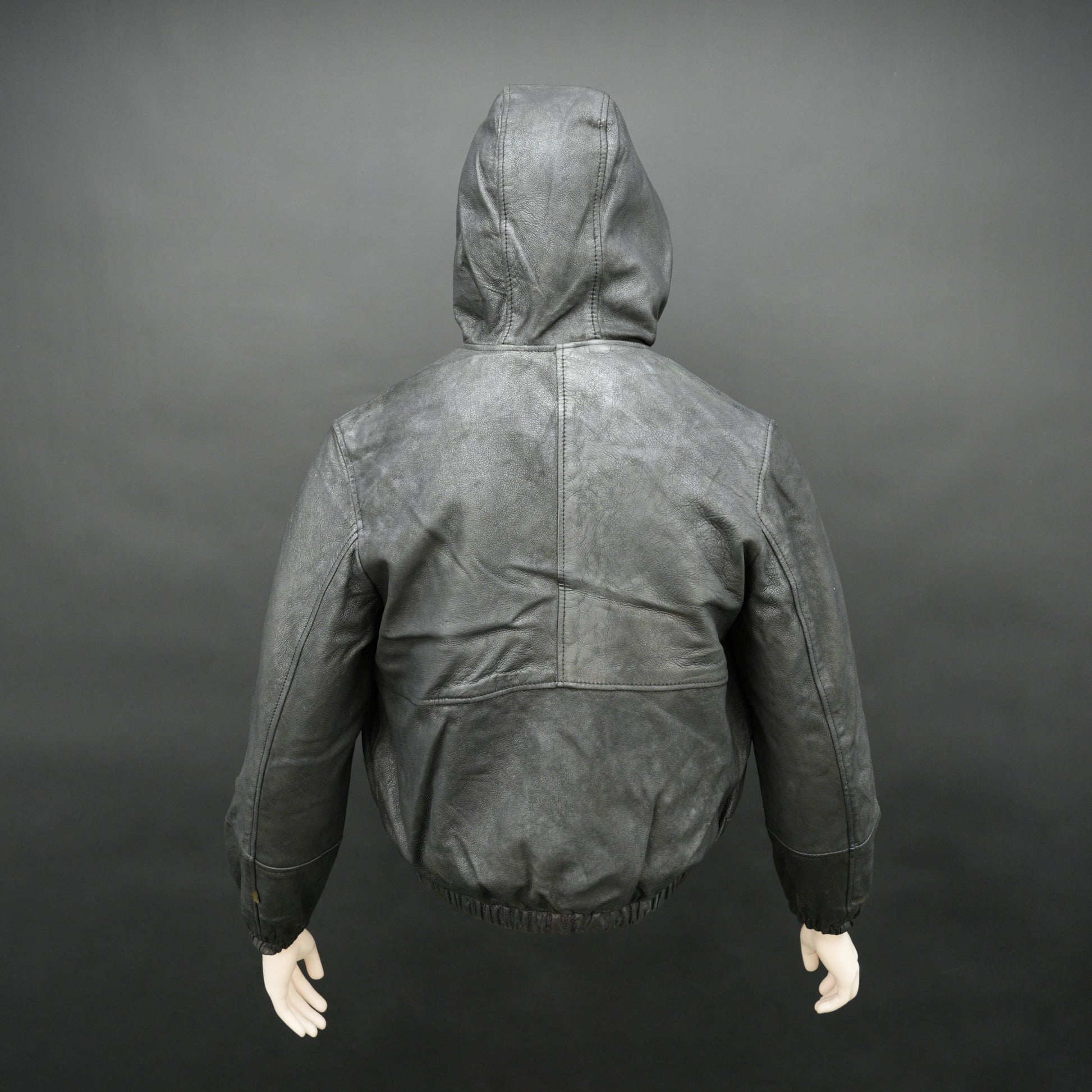 Black hoodie-style jacket made from genuine sheep leather (veg ranger), featuring a front zip closure, adjustable hood, two side pockets, and one inside pocket