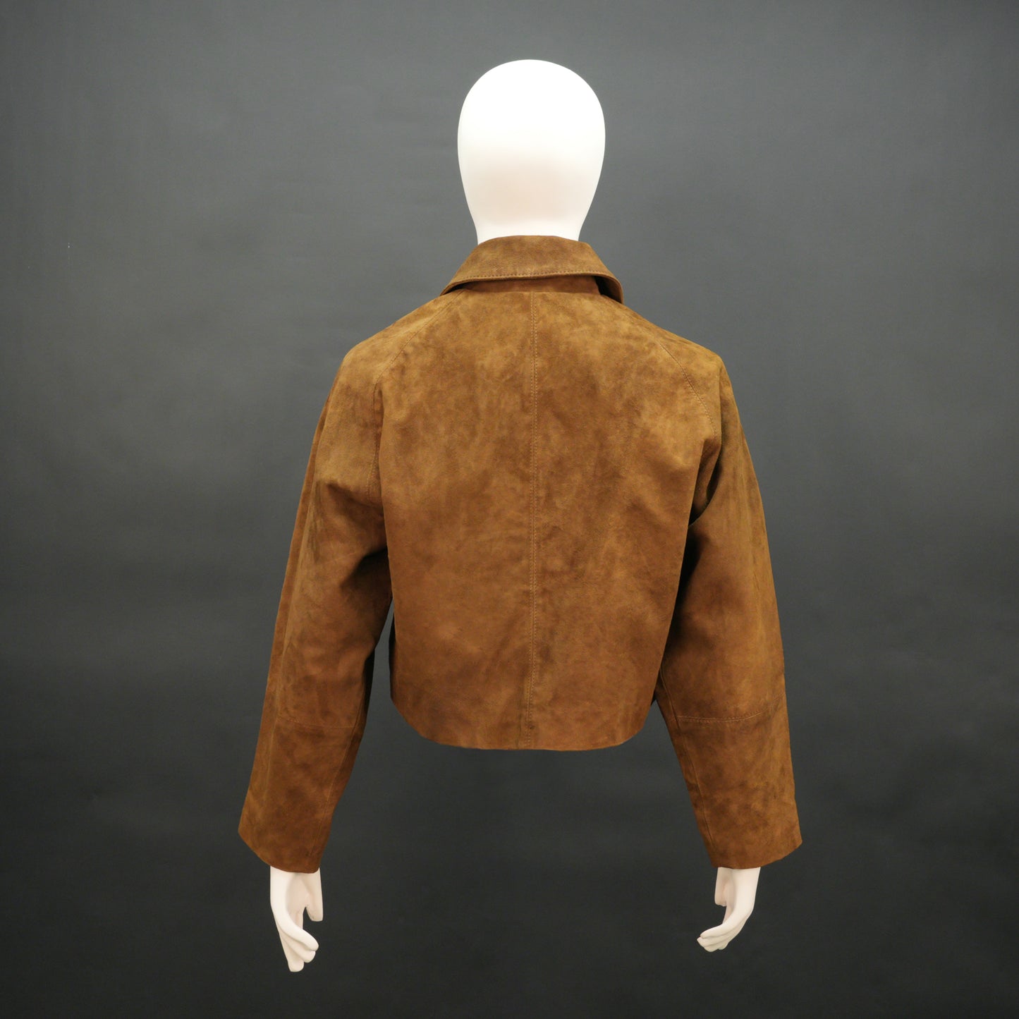 Brown suede leather jacket with button closure, slim fit, side pockets, and soft premium suede finish