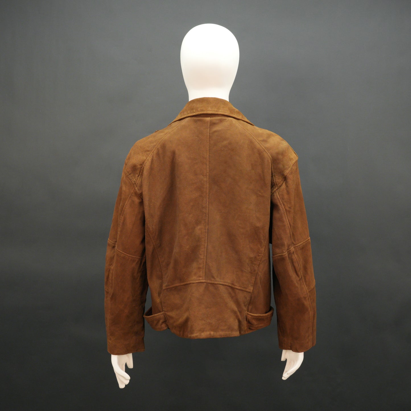 Light brown goat suede perfecto jacket with leather-finish, soft suede texture, three exterior pockets, secure side zip pocket, and adjustable zipped cuffs for a tailored fit