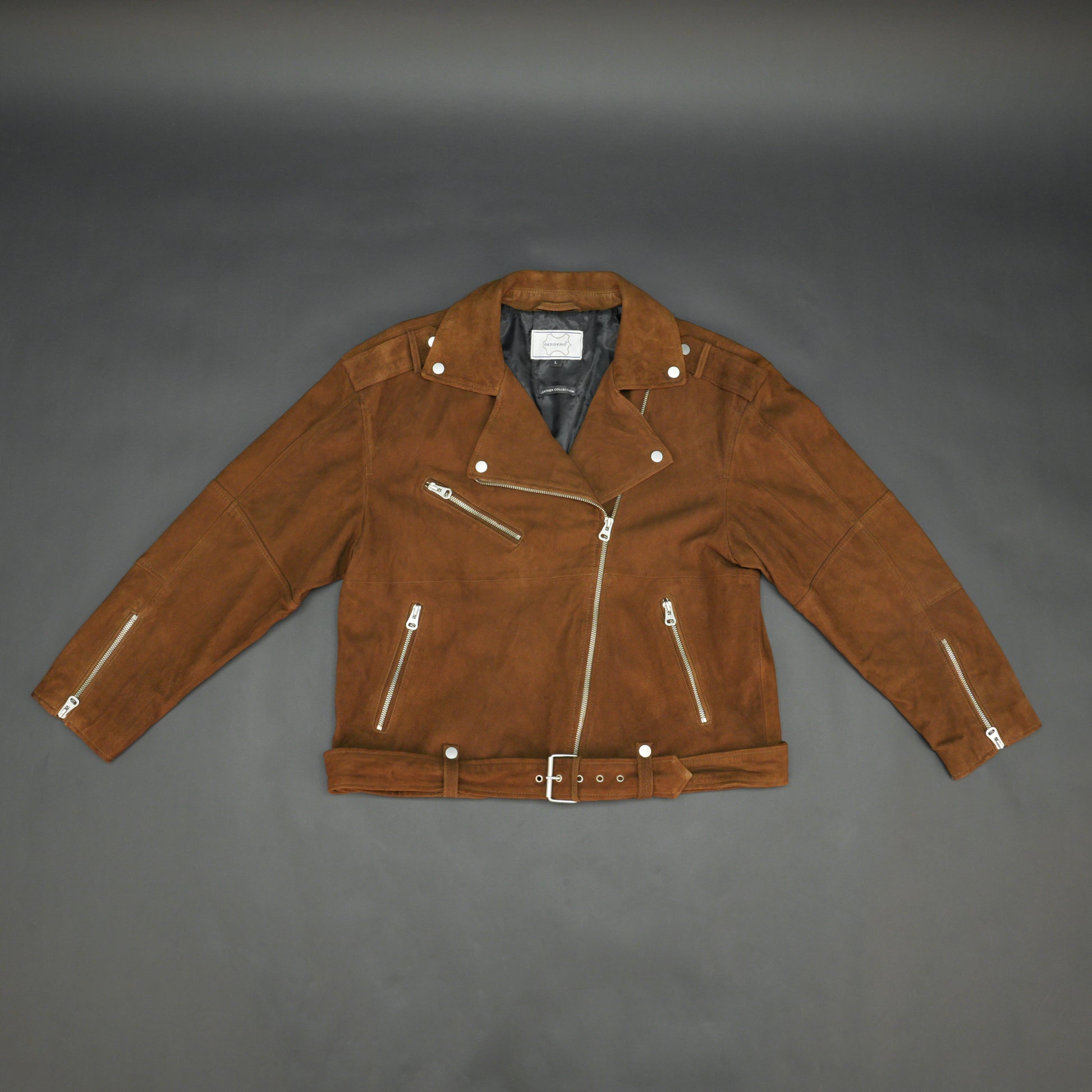 Light brown goat suede perfecto jacket with leather-finish, soft suede texture, three exterior pockets, secure side zip pocket, and adjustable zipped cuffs for a tailored fit