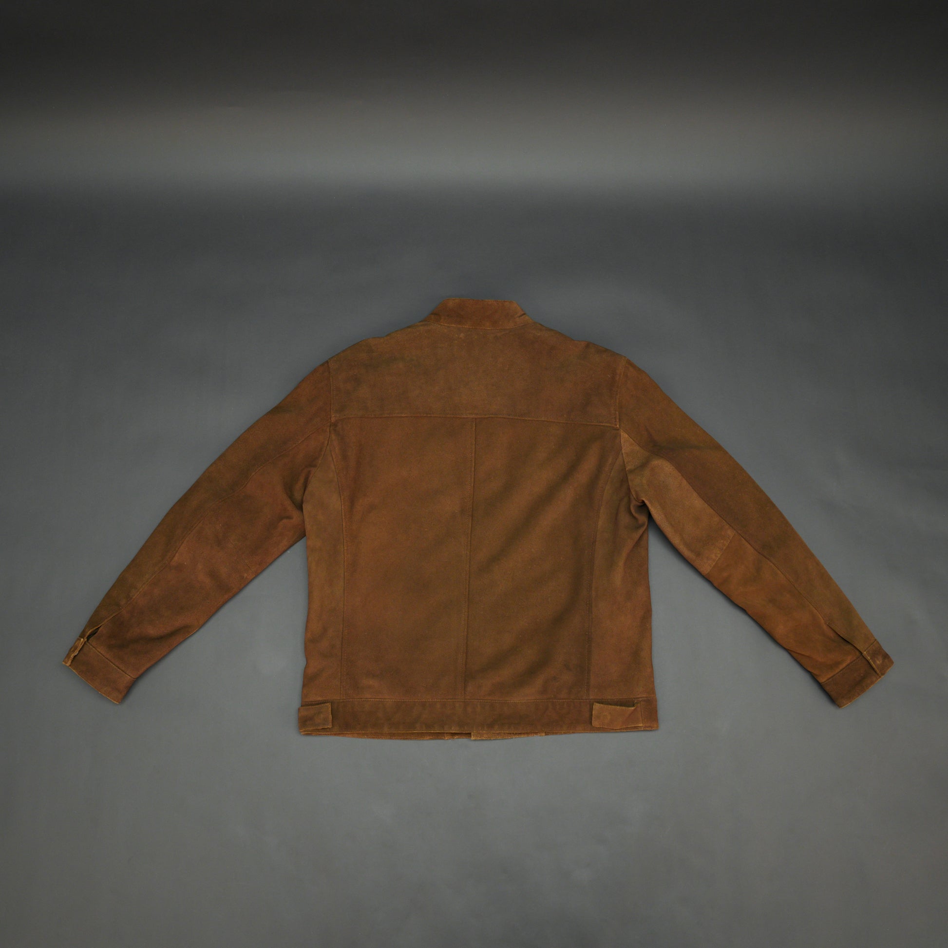 Brown suede leather jacket with front pocket and unique button and zip opening