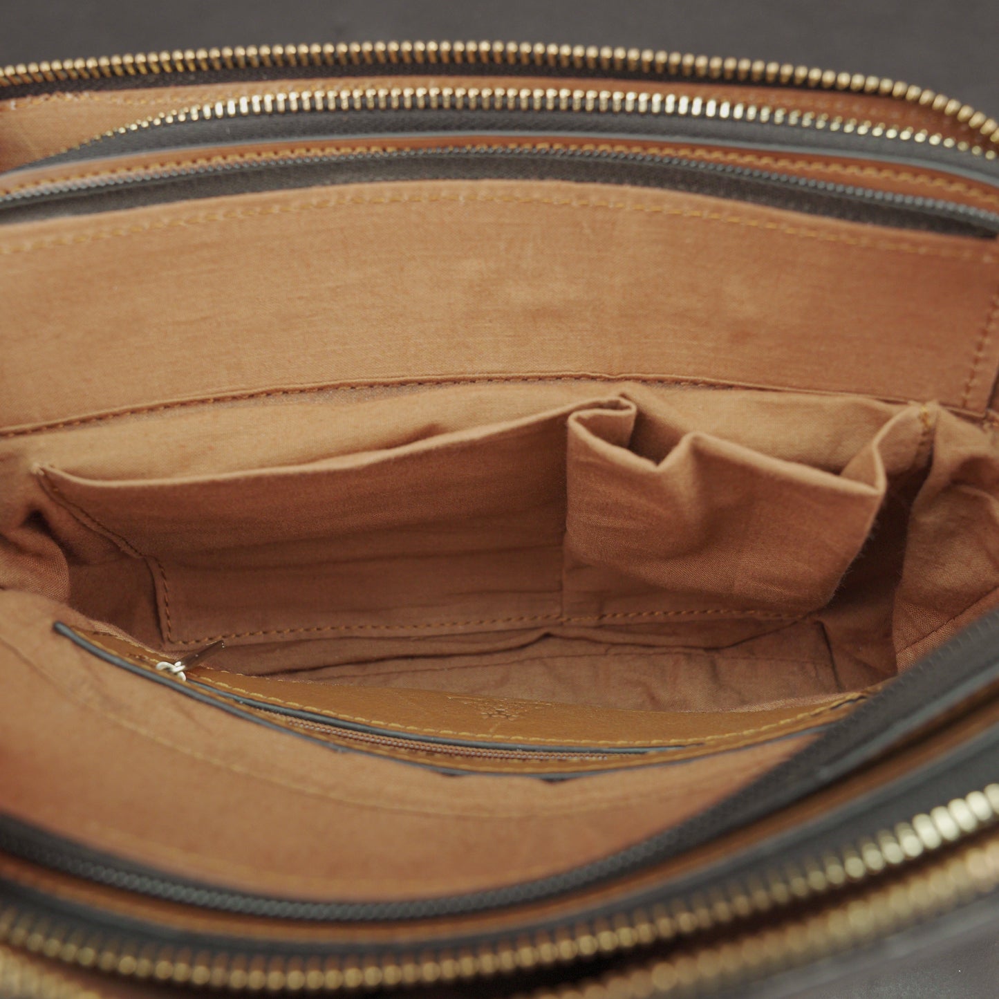Nano Casetto Leather Crossbody Bag in 100% genuine cowhide leather with a compact, lightweight design, adjustable strap, and secure zip closure—perfect for daily wear, travel, and casual outings.