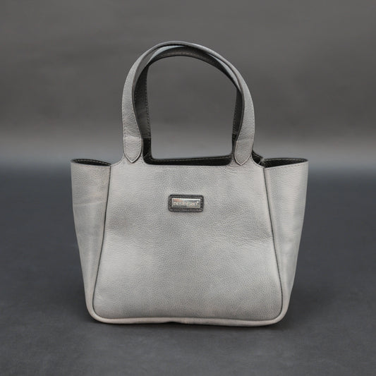 Premium grey cow vachetta leather bag with spacious compartment and inner pockets.