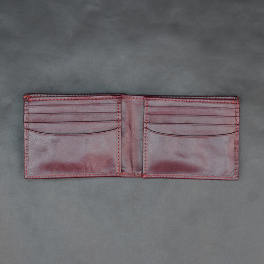 Premium maroon leather wallet, slim and durable, holds 10 cards with 2 cash compartments.