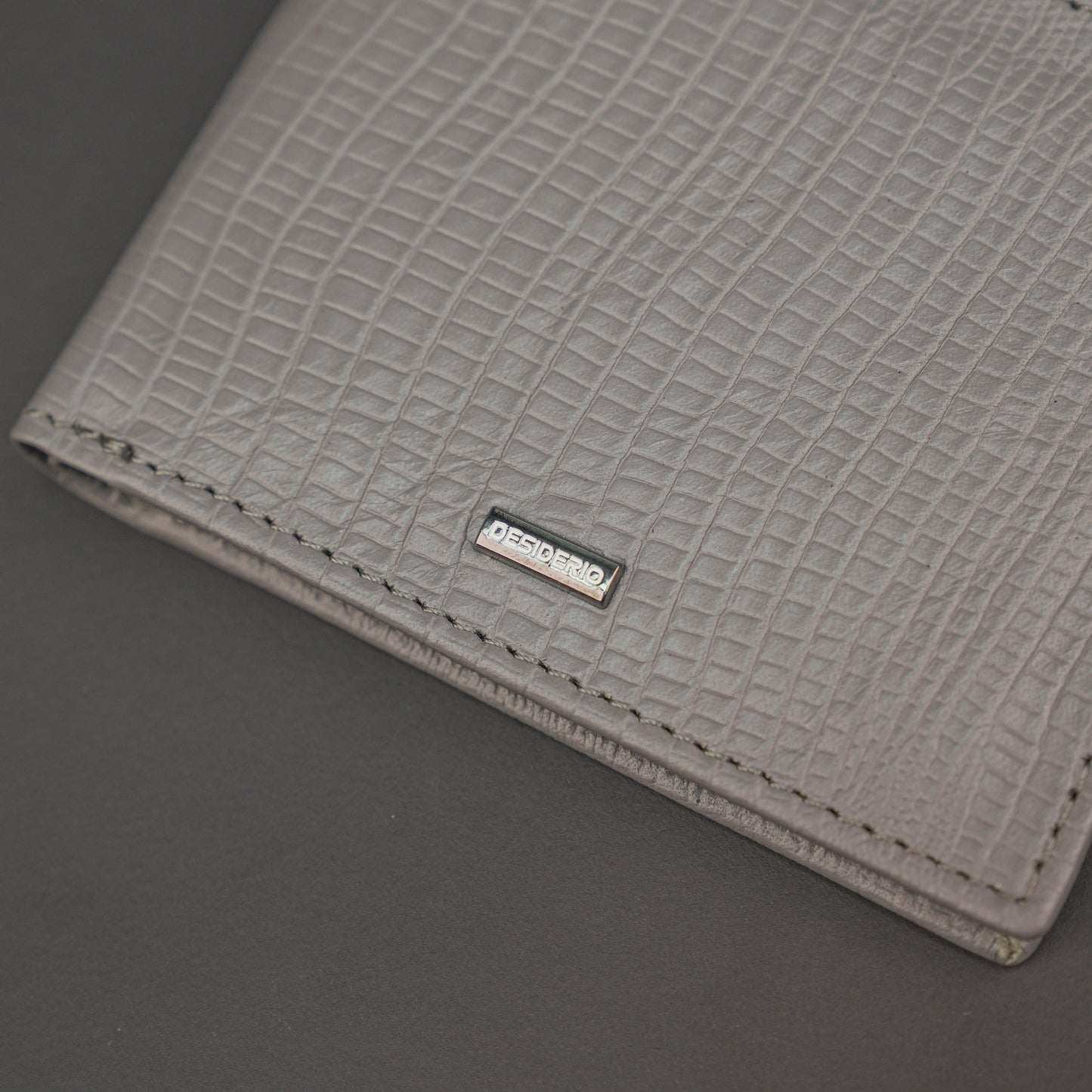 Premium grey leather wallet, sleek and compact holds 6 cards, 1 ID, and 2 cash compartments for everyday use.