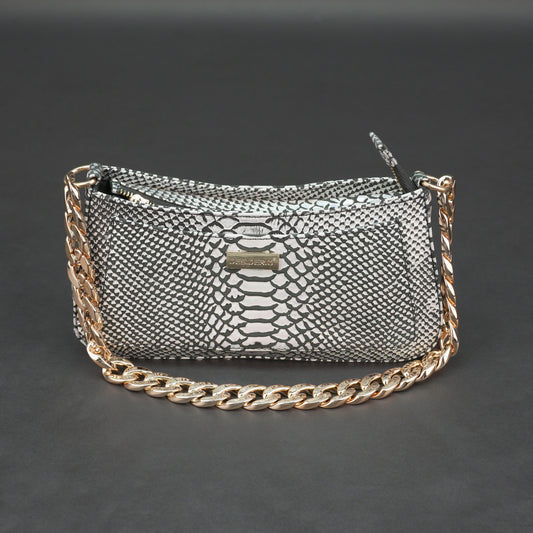 Real leather handbag with gold chain and zipper compartment.