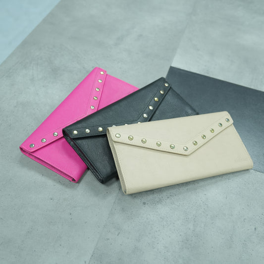 Elegant clutch available in beige, black, and pink, featuring a sleek design with three spacious compartments, a secure zip pocket, and dedicated card slots for organized storage