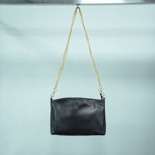 Classic black genuine leather bag featuring a spacious main compartment, two cash pockets, and a secure zip pocket—designed for timeless style and everyday practicality