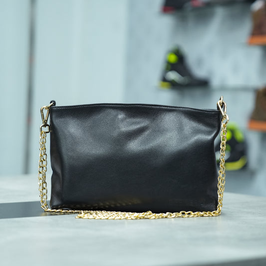 Classic black genuine leather bag featuring a spacious main compartment, two cash pockets, and a secure zip pocket—designed for timeless style and everyday practicality