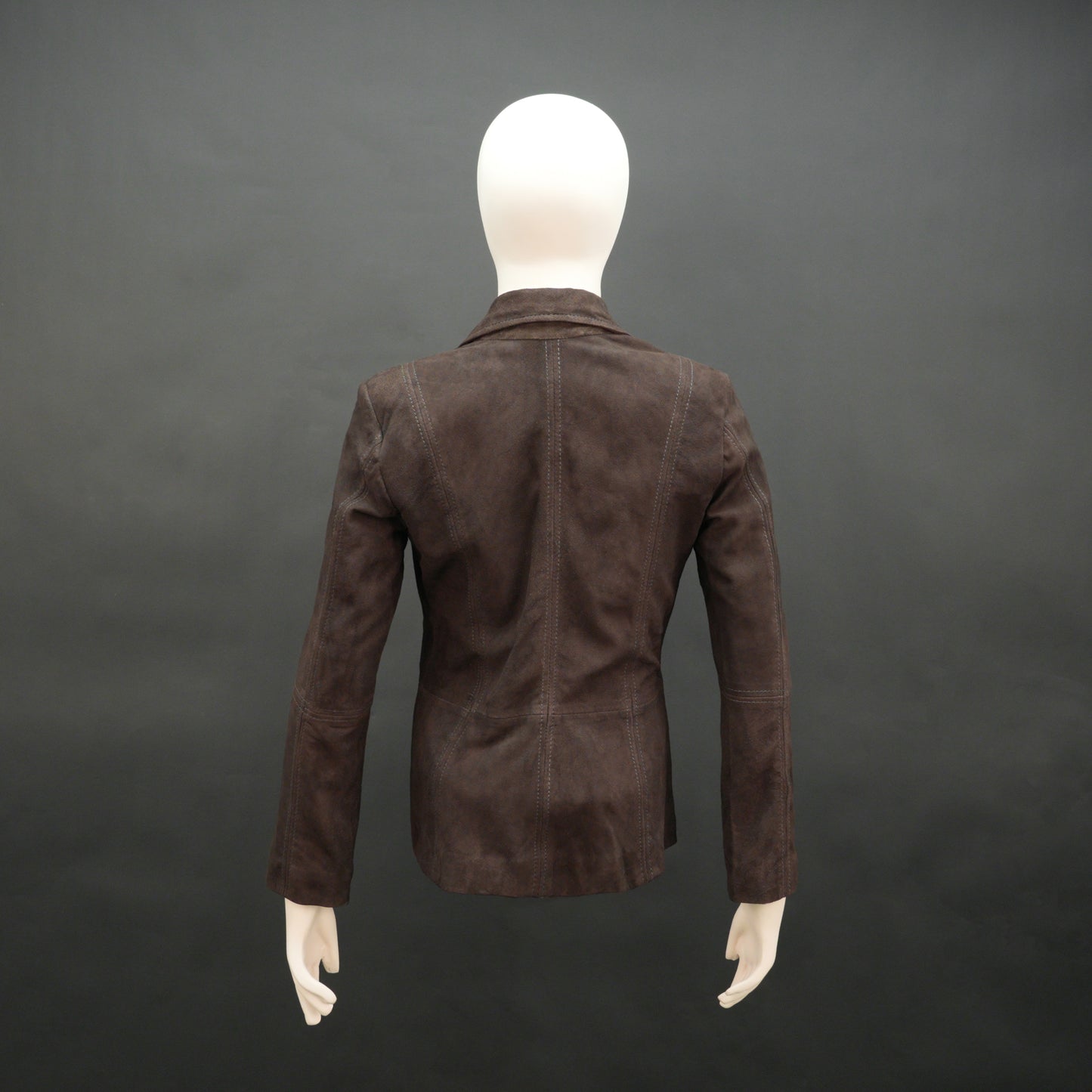 Dark brown goat leather coat with soft, durable material, two functional pockets, and versatile design for casual and formal wear