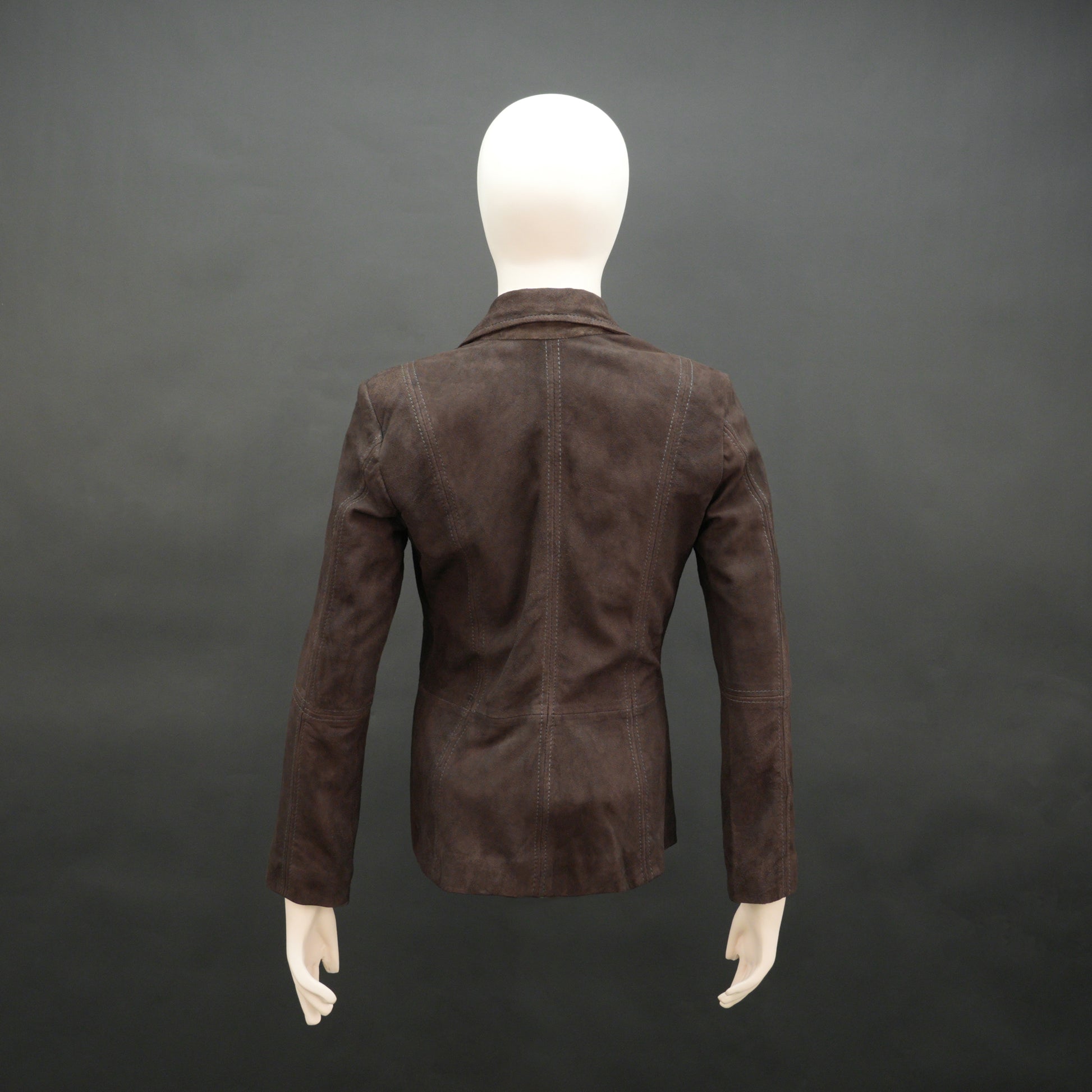 Dark brown goat leather coat with soft, durable material, two functional pockets, and versatile design for casual and formal wear
