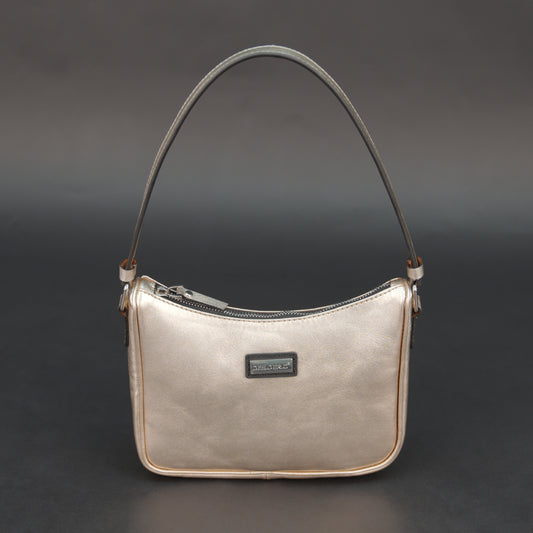 Metallic premium cow leather bag with zip closure, main compartment, and inner pocket for daily use.
