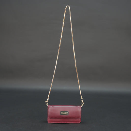 Burgundy goat leather bag with chain strap, main compartment, and inner pocket.