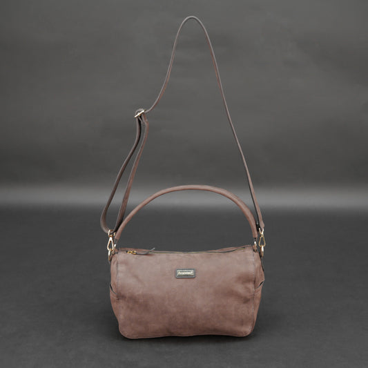 Choco cow Chelsea leather bag with zip compartments and pockets.
