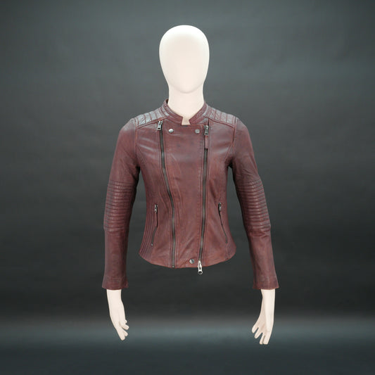 Women maroon leather biker jacket with quilted shoulders and front zip.
