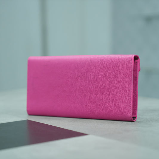 Pink leather clutch with three main compartments, one zip pocket, and three card pockets for organized storage