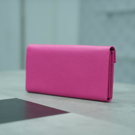 Pink leather clutch with three compartments, sixteen card slots, a zip pocket, cash compartment, and key for security