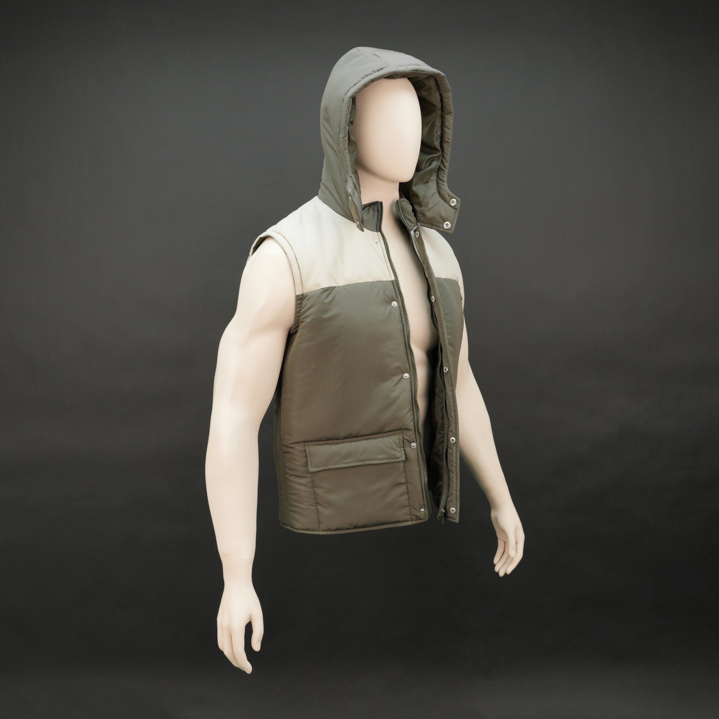 Green-cream sleeveless puffer jacket with zip and snap closure, hood, side and inner pockets, quilted for transitional seasons.