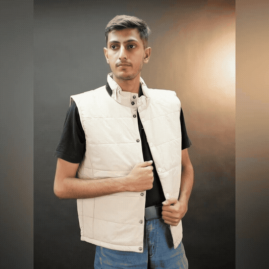 Teen beige and grey puffer vest with button closure, two side snap pockets, one inner pocket, lightweight and warm for winter