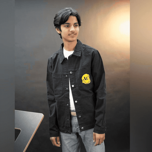 Men’s green and black denim jacket with bold ‘Stay Blessed’ graphic on the back, button-down front, adjustable cuffs, and side pockets