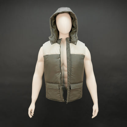 Green-cream sleeveless puffer jacket with zip and snap closure, hood, side and inner pockets, quilted for transitional seasons.