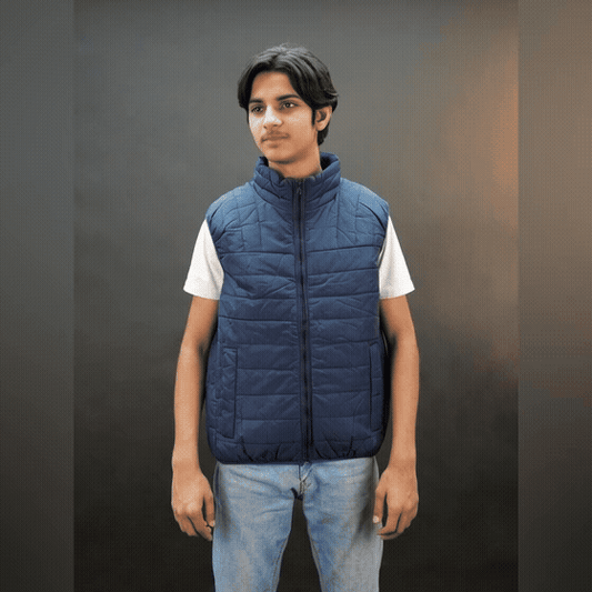 Teen lightweight puffer vest in blue and black with full front zip, two side snap pockets, and two inside pockets, warm and ideal for winter