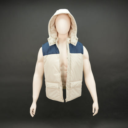 Cream-blue two-tone sleeveless puffer jacket with zip and snap closure, hood, side and inner pockets, quilted for layering