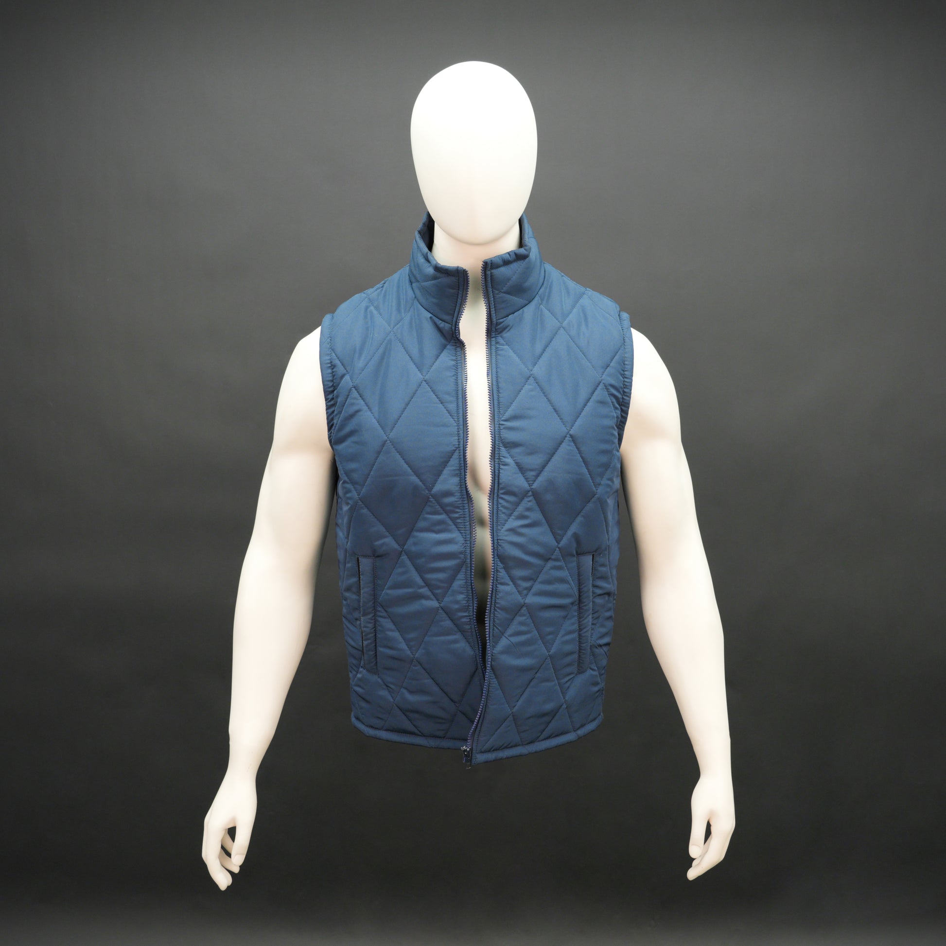 Blue sleeveless puffer vest with zip, side and inside pockets, lightweight for layering