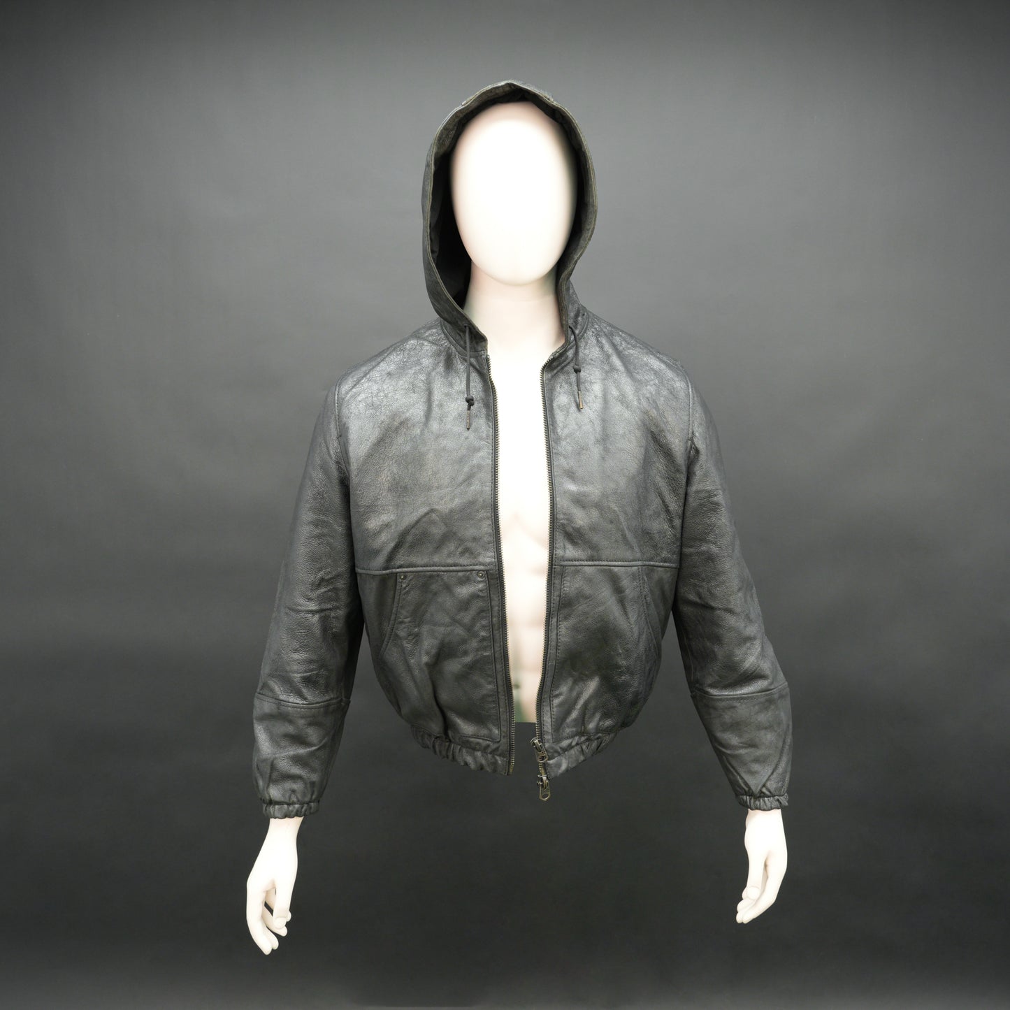 Black hoodie-style jacket made from genuine sheep leather (veg ranger), featuring a front zip closure, adjustable hood, two side pockets, and one inside pocket