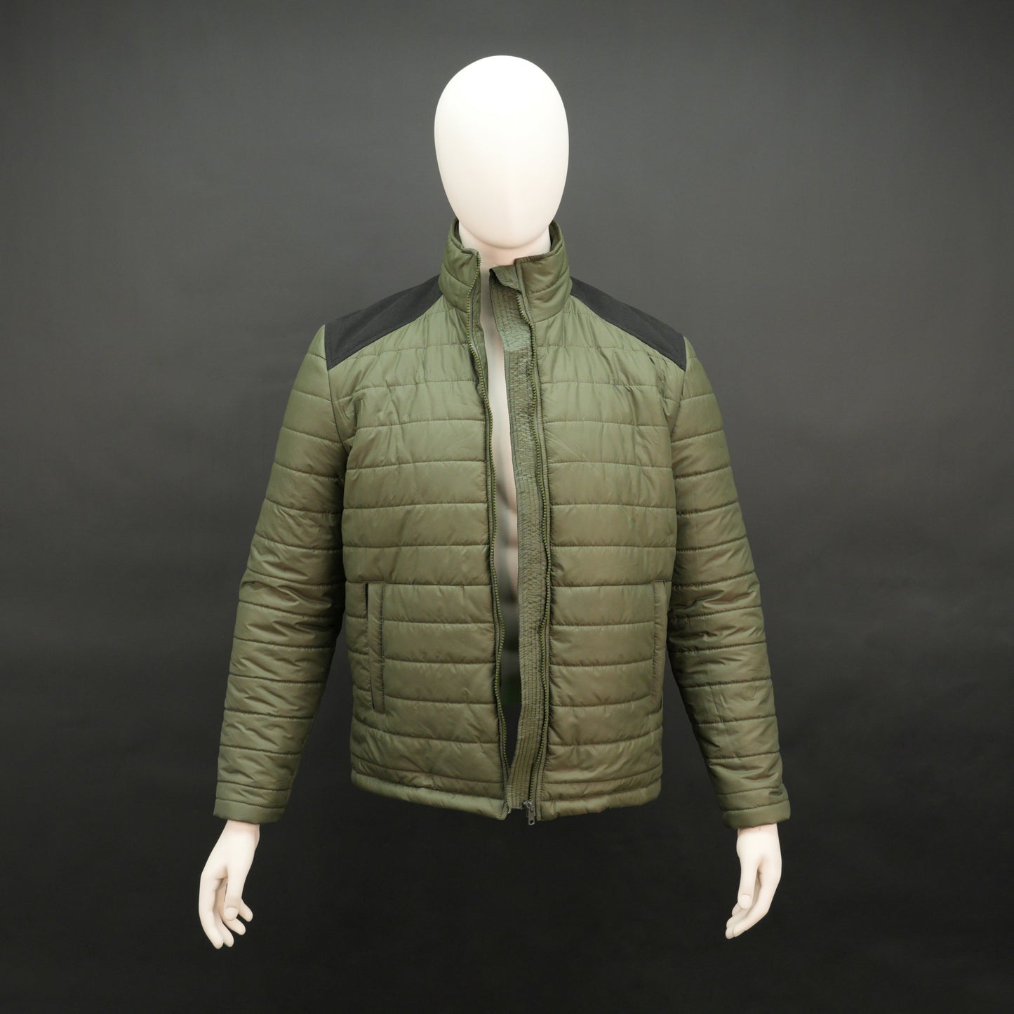 Green full-sleeve two-tone puffer jacket with snap pockets, quilted insulation, inner compartments, and zip closure