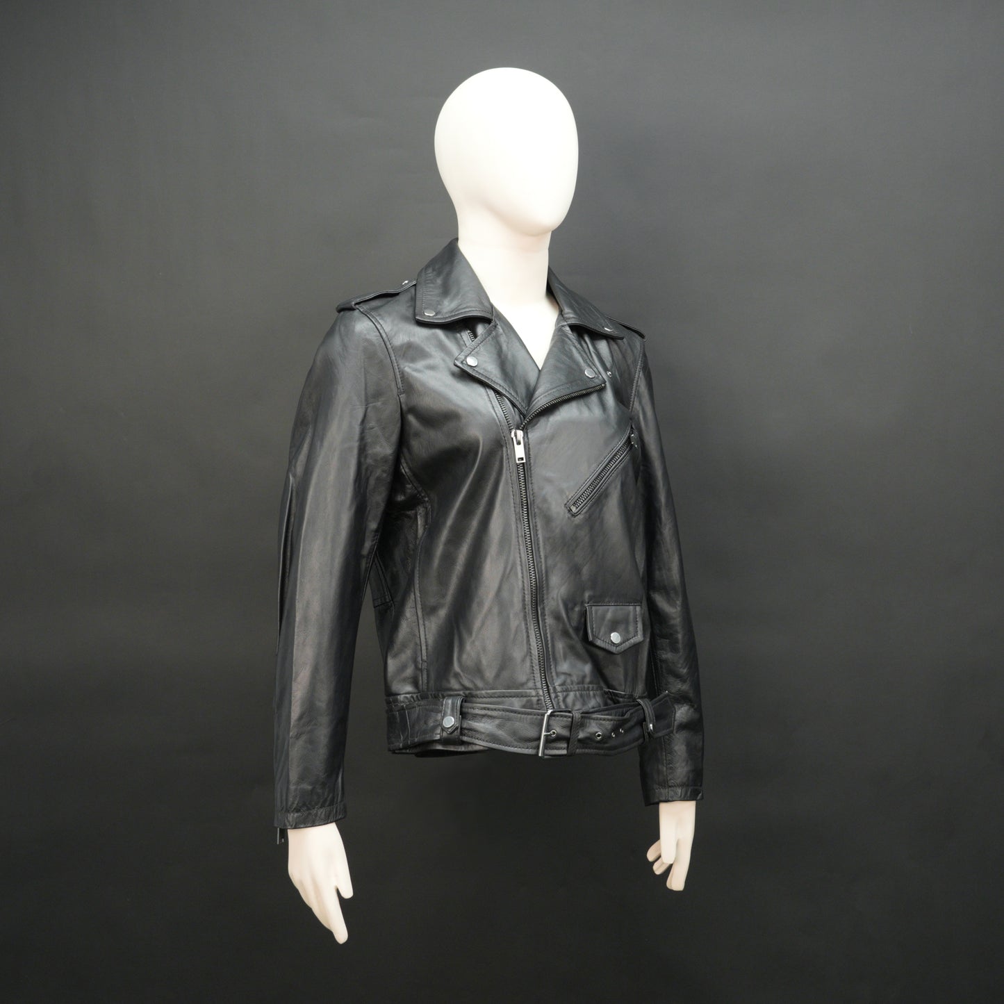 Black sheep leather jacket with adjustable waist belt, two front side pockets, one inside pocket, and zip flap closure