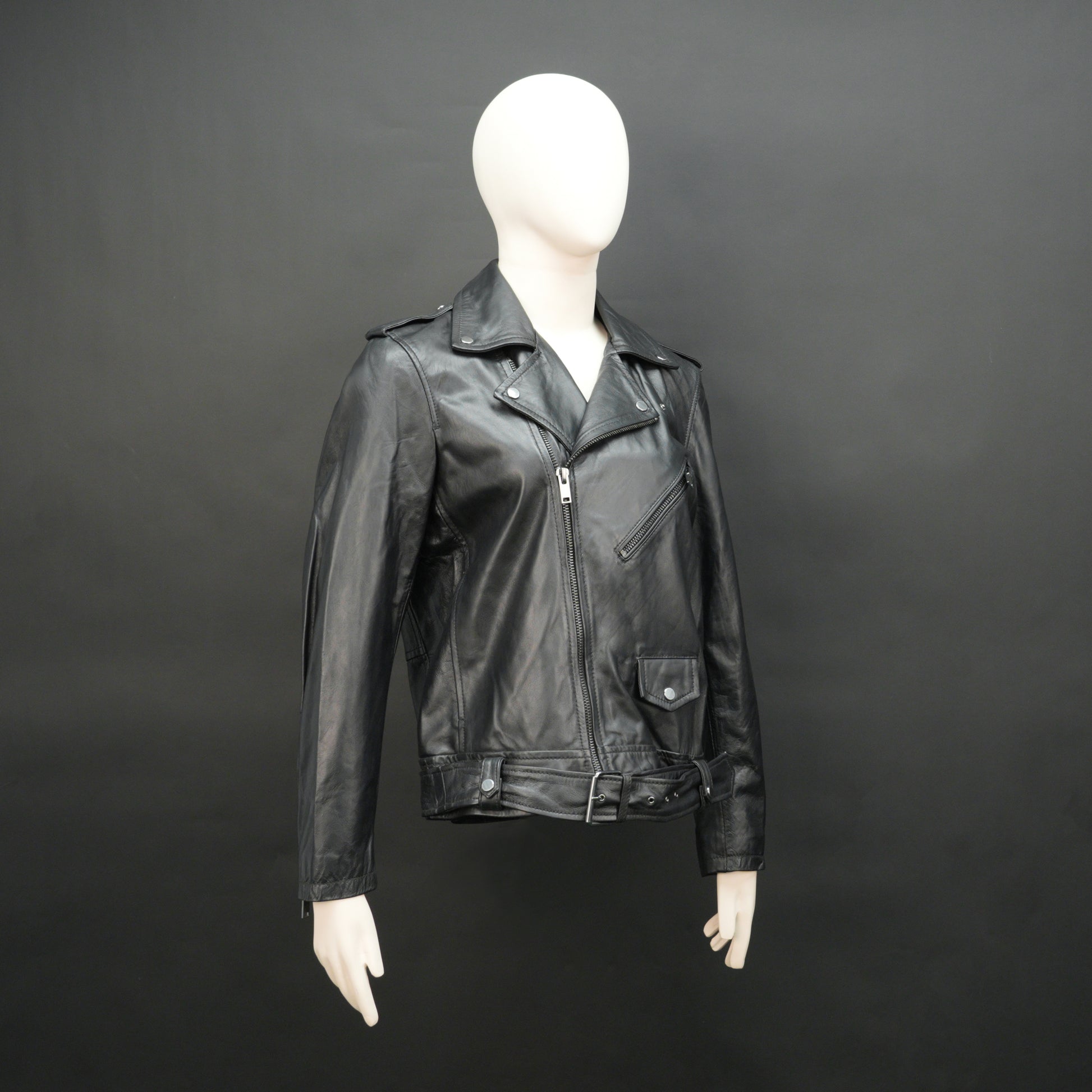 Black sheep leather jacket with adjustable waist belt, two front side pockets, one inside pocket, and zip flap closure