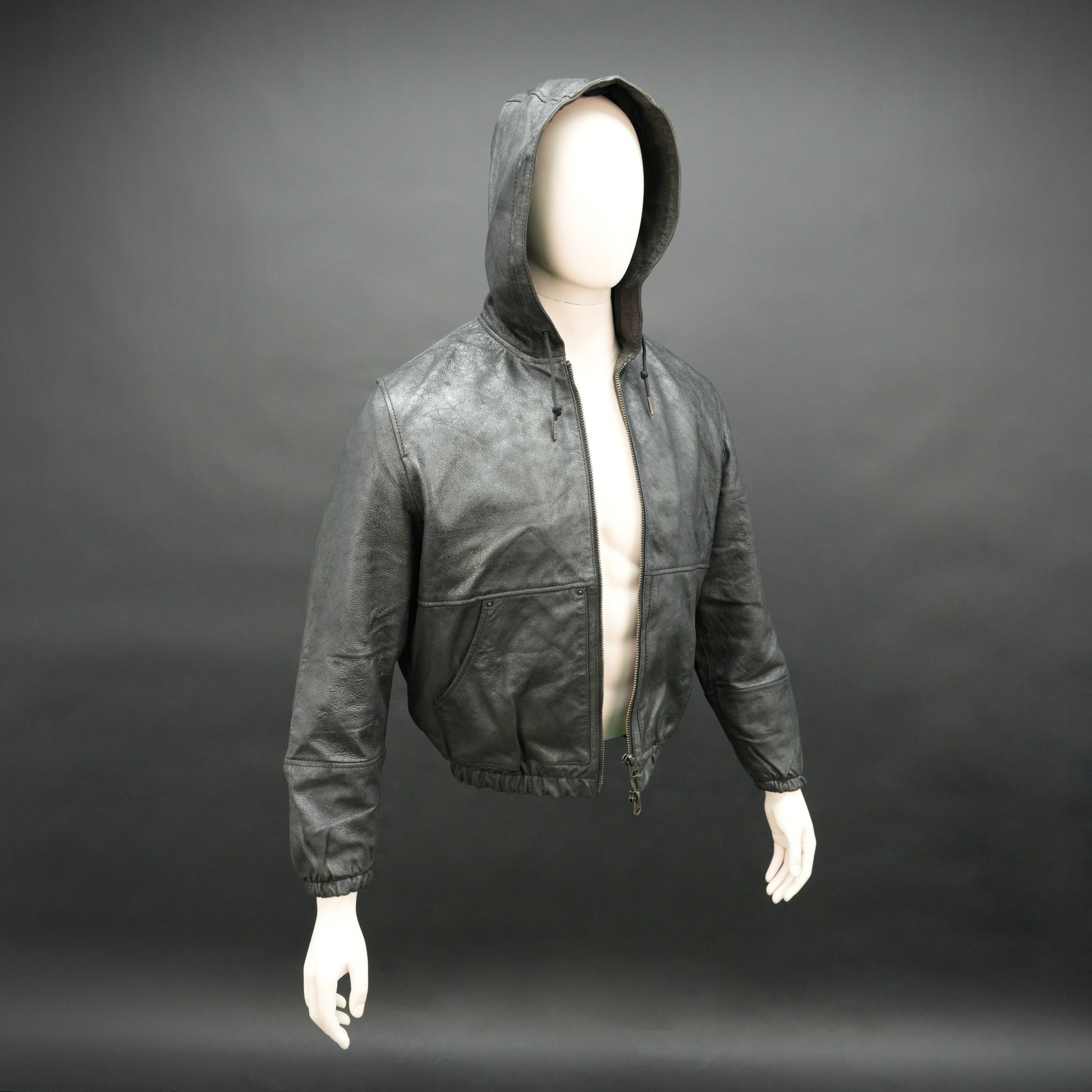 Black hoodie-style jacket made from genuine sheep leather (veg ranger), featuring a front zip closure, adjustable hood, two side pockets, and one inside pocket