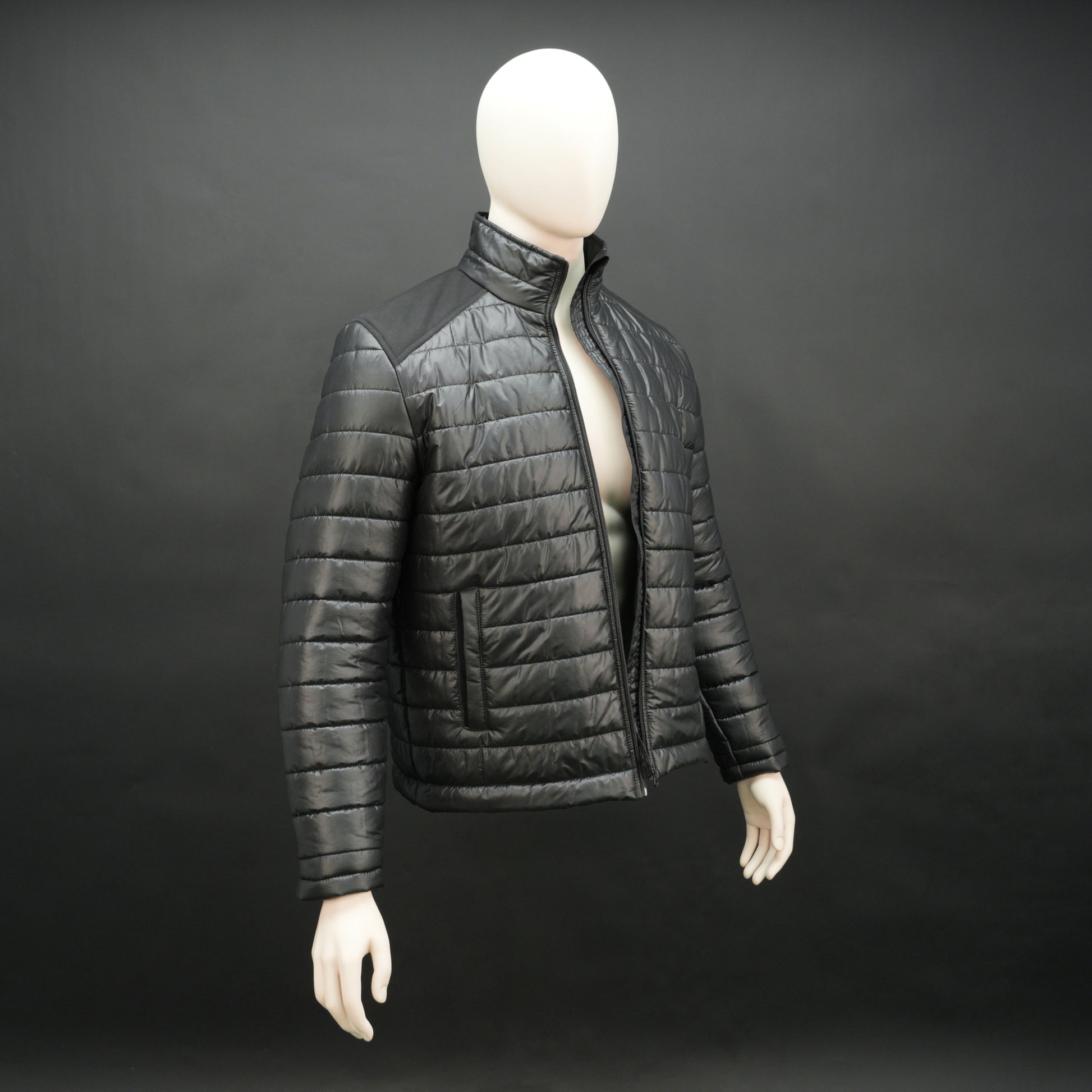 Black full-sleeve two-tone puffer jacket with snap pockets, quilted insulation, inner compartments, and zip closure