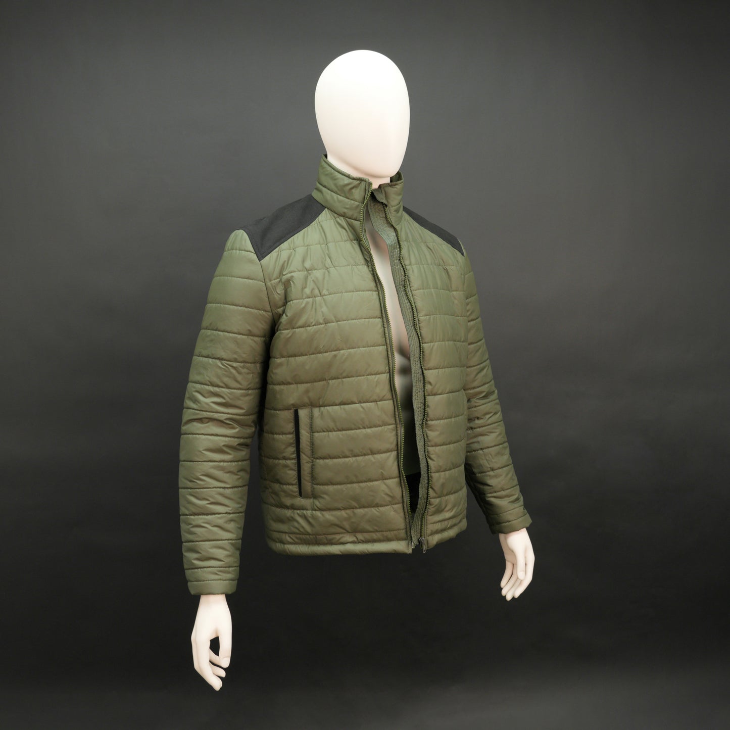 Green full-sleeve two-tone puffer jacket with snap pockets, quilted insulation, inner compartments, and zip closure