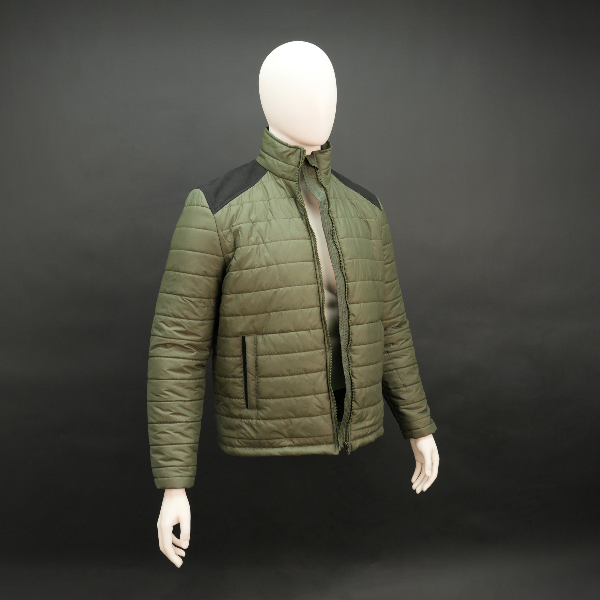 Green full-sleeve two-tone puffer jacket with snap pockets, quilted insulation, inner compartments, and zip closure