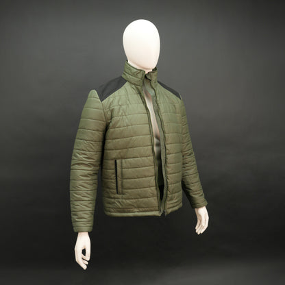Green full-sleeve two-tone puffer jacket with snap pockets, quilted insulation, inner compartments, and zip closure