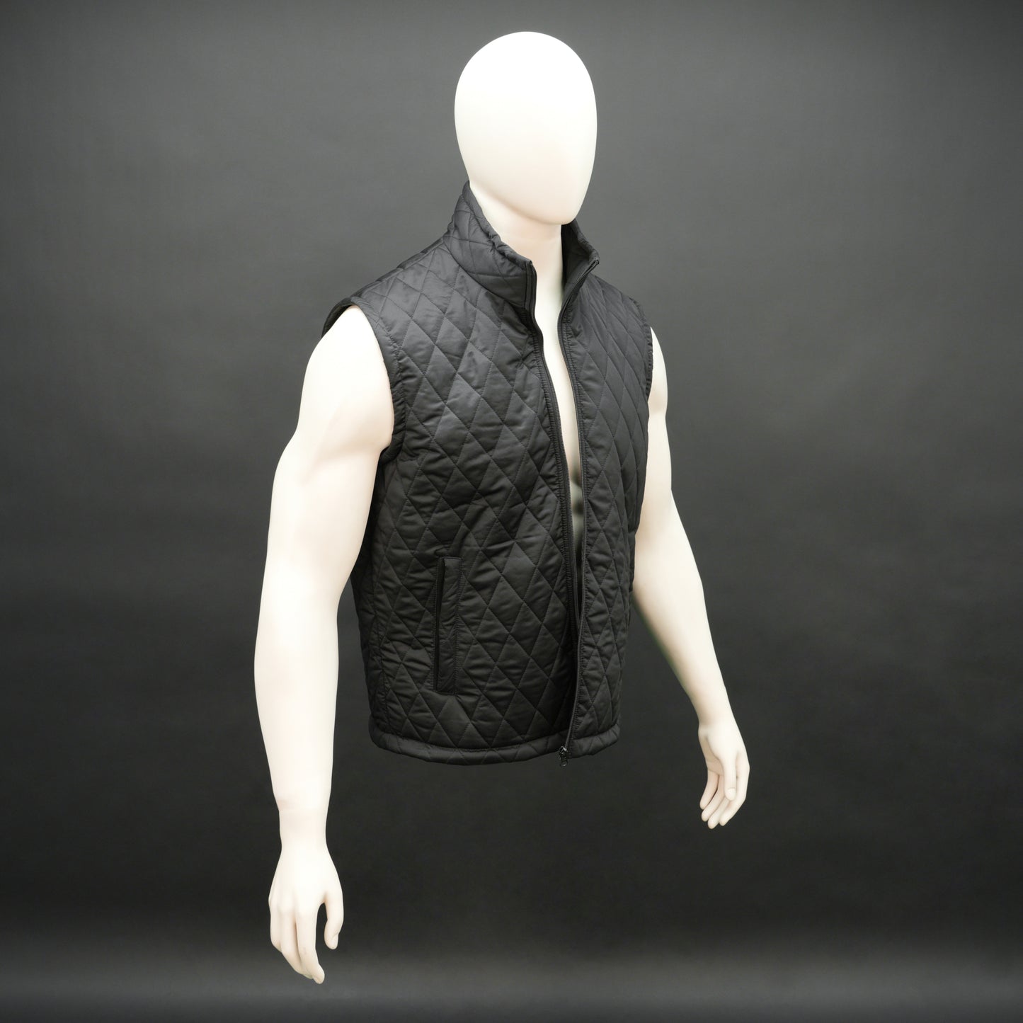 Lightweight black quilted sleeveless  puffer vest with zip closure, side and inside pockets, ideal for layering