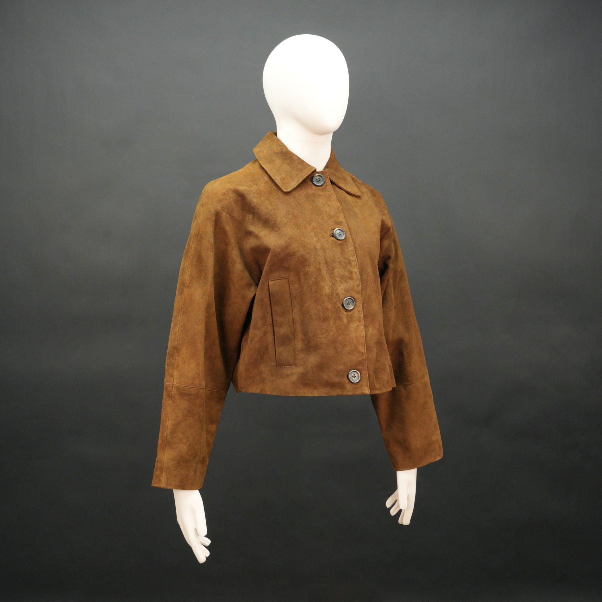 Brown suede leather jacket with button closure, slim fit, side pockets, and soft premium suede finish