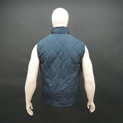 Lightweight navy sleeveless puffer vest with zip closure, side and inside pockets, for layering