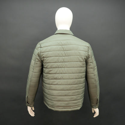 Green full-sleeve puffer jacket with snap closure, quilted padding, inner and outer pockets, designed for everyday comfort.