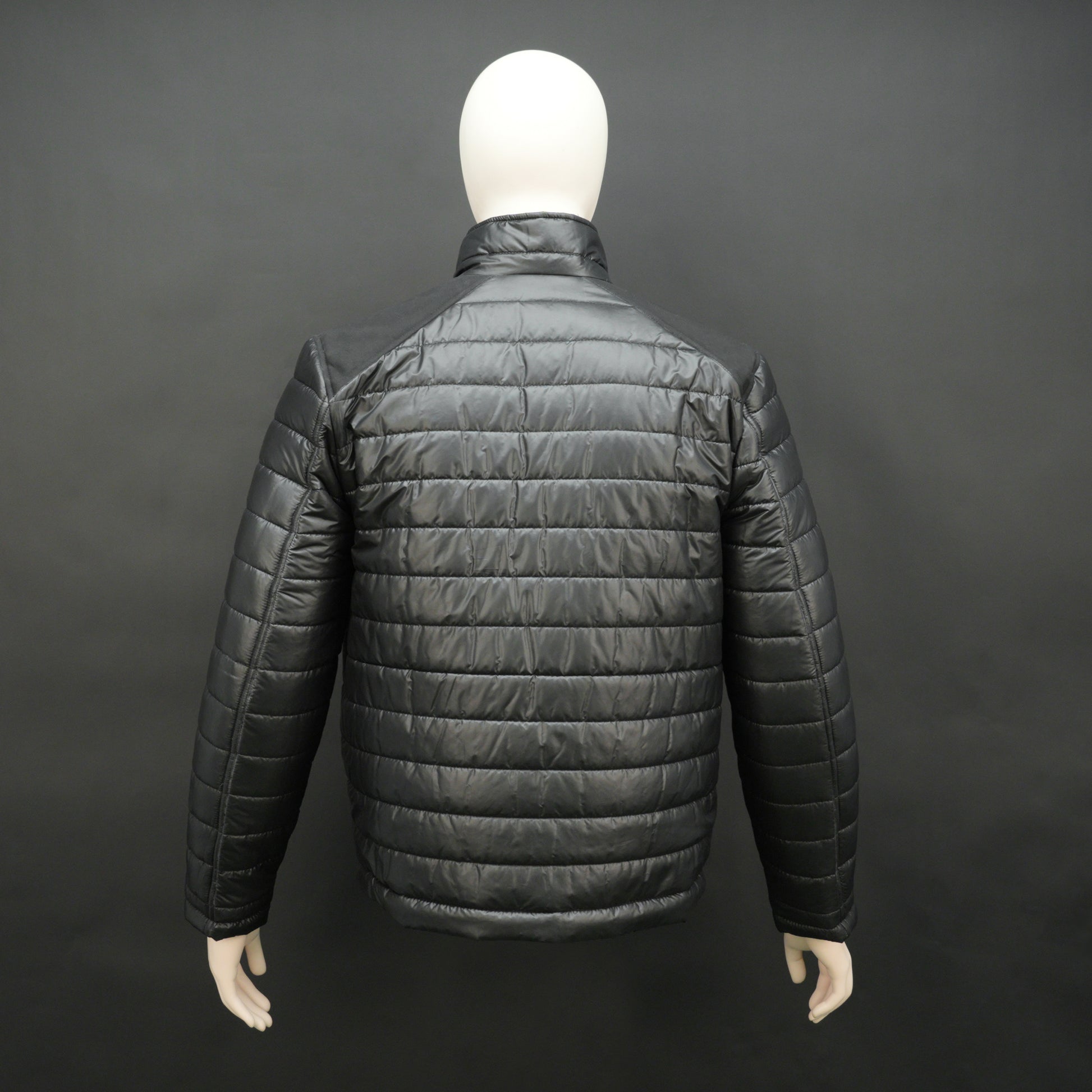Black full-sleeve two-tone puffer jacket with snap pockets, quilted insulation, inner compartments, and zip closure
