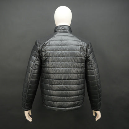 Black full-sleeve two-tone puffer jacket with snap pockets, quilted insulation, inner compartments, and zip closure