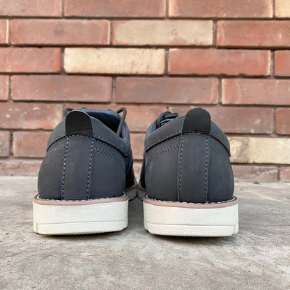 Gray NX-011 footwear with genuine cow leather upper, soft sheep lining, Taxon insole for stability, lightweight EVA sole, and minor fault