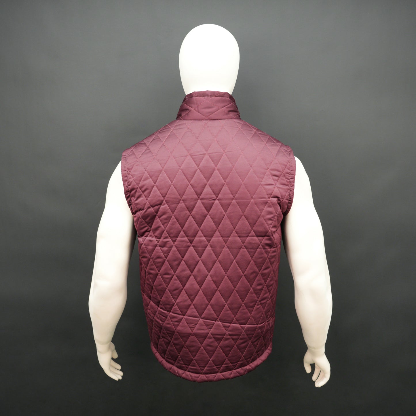 Maroon quilted sleeveless  puffer vest with zip closure, side and inside pockets, ideal for layering