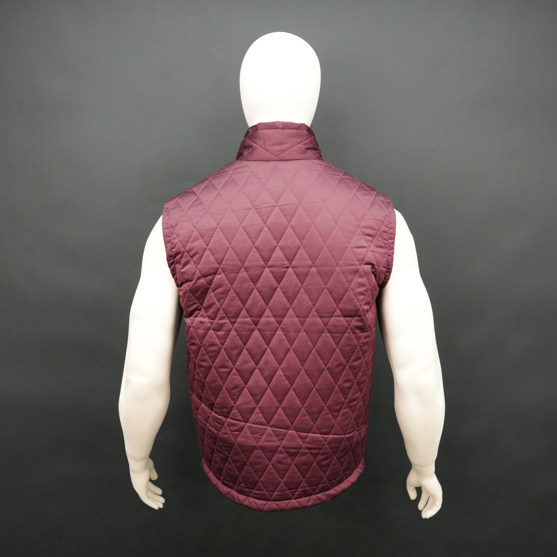 Maroon quilted sleeveless  puffer vest with zip closure, side and inside pockets, ideal for layering