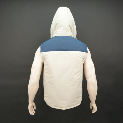 Cream-blue two-tone sleeveless puffer jacket with zip and snap closure, hood, side and inner pockets, quilted for layering