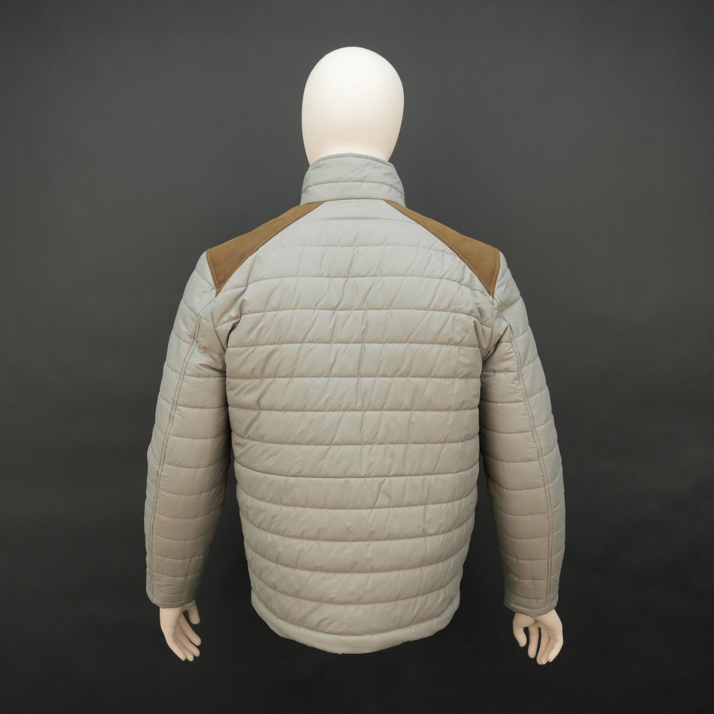 Grey full-sleeve two-tone puffer jacket with snap pockets, quilted insulation, inner compartments, and zip closure