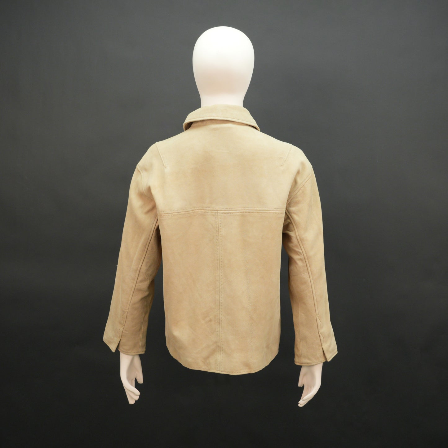 Beige suede leather jacket with tailored fit, elegant button opening, and front side pockets